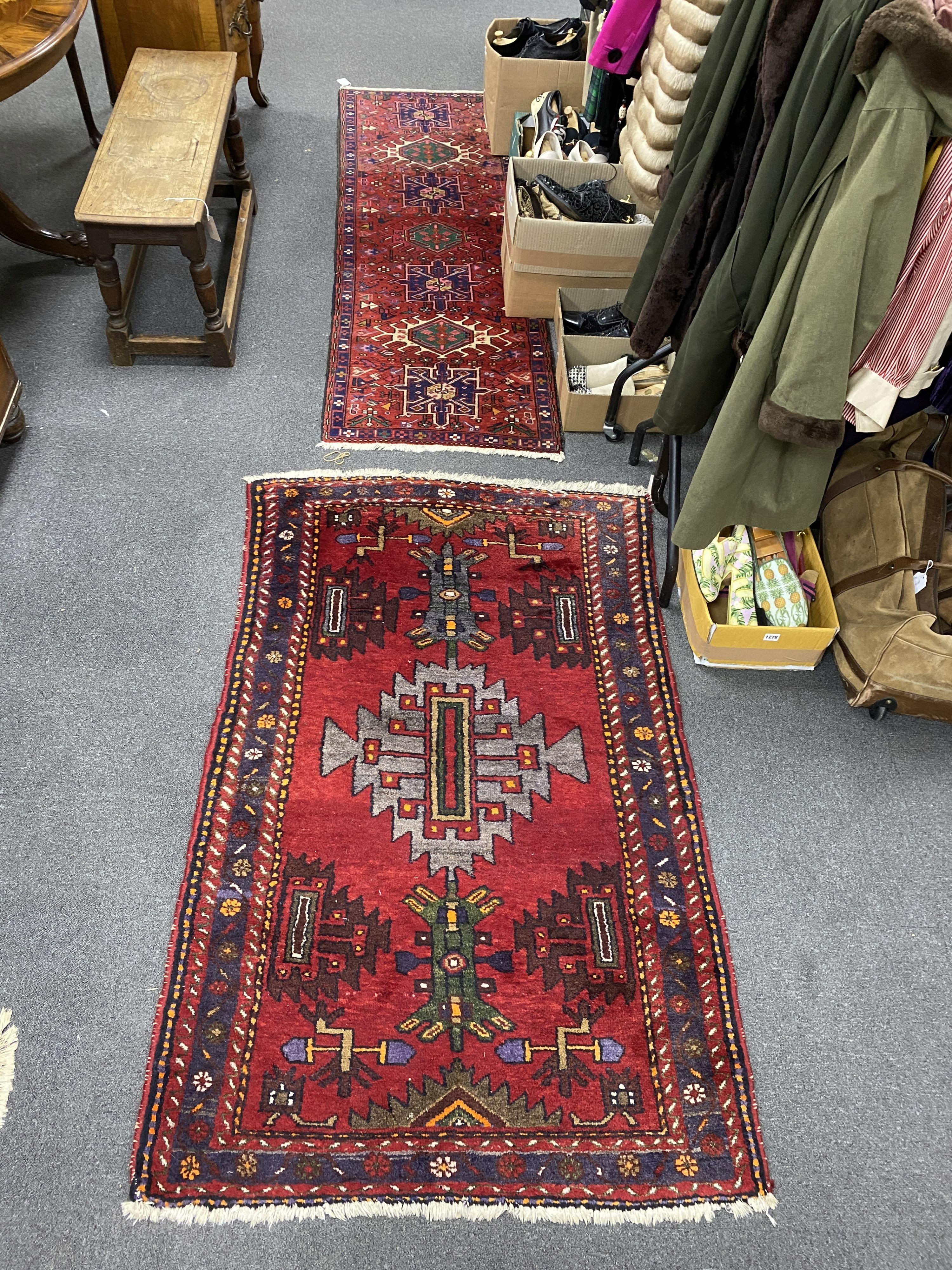 A Caucasian red ground rug, 160 x 100cm and similar runner